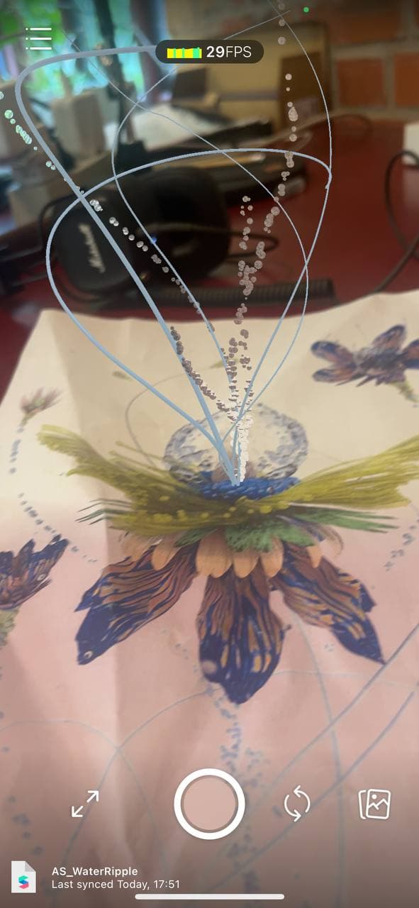Still from the prototype, with pearl orbs around the flower.